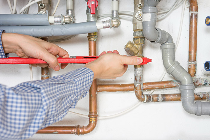 Tacoma plumbing contractor removes a corroded intake line for a washing machine