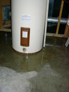 broken water heater leaks on floor